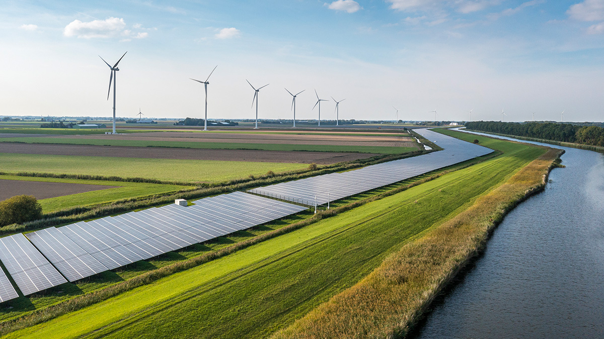 Aerial view of windmills and solar panels