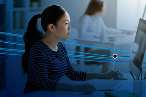 Asian woman looking at computer