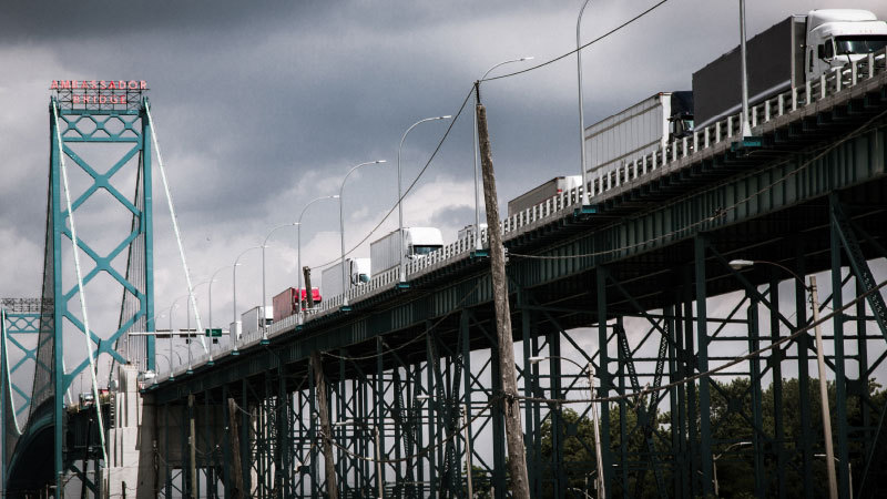 Trucks going over a Canadian bridge