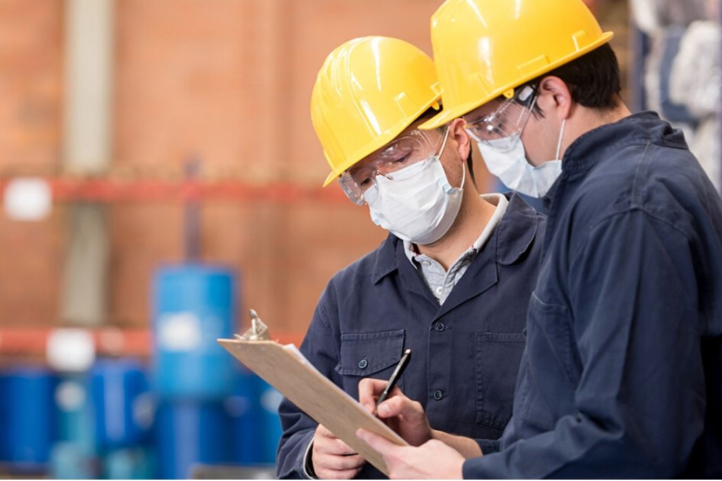 Dock workers with PPE at a warehouse
