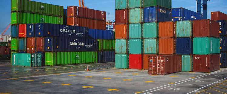 Stacked global shipping containers at port