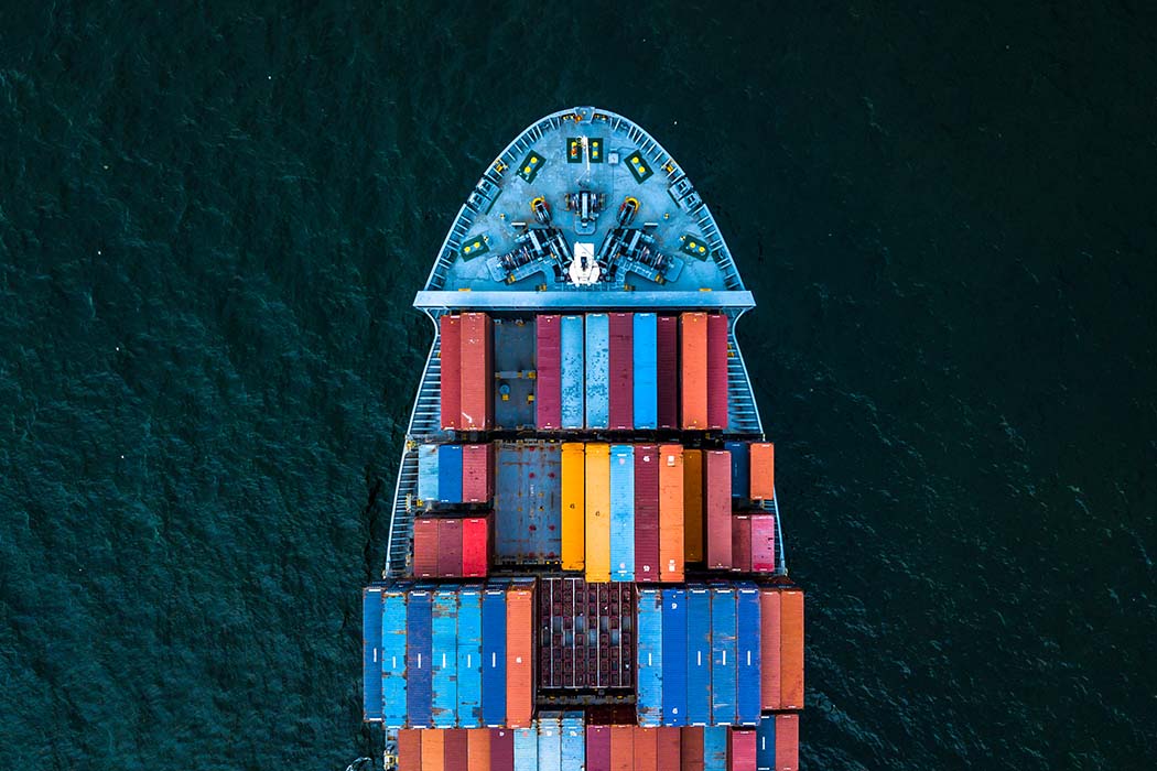 Container ship loaded with cargo depicting customs and trade policy developments