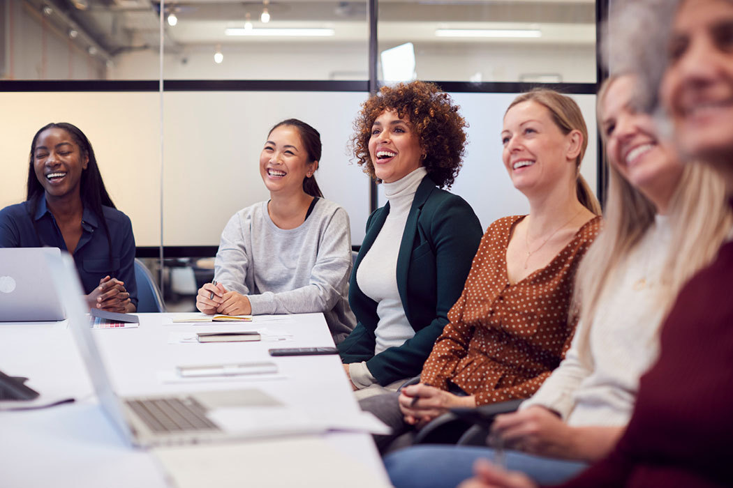 People sitting around a table in a conference room