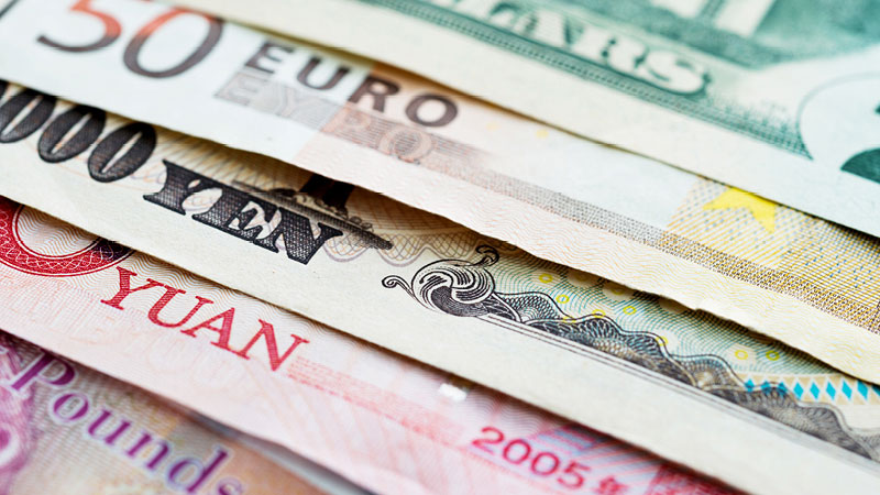 close-up view of paper money in various currencies