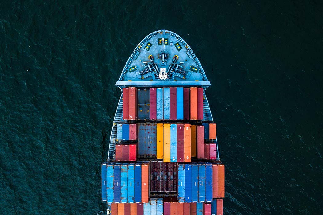 Container ship loaded with cargo depicting customs and trade policy developments