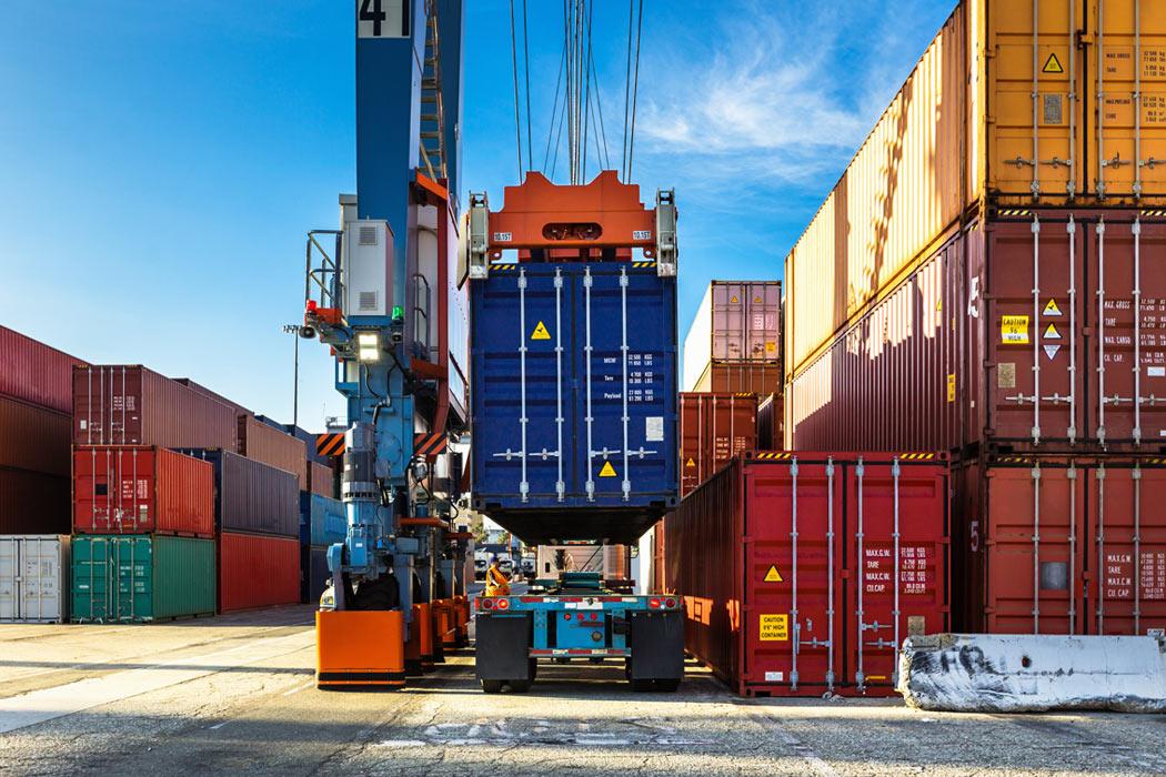 Container being loaded onto ship depicting three benefits of LCL shipping 