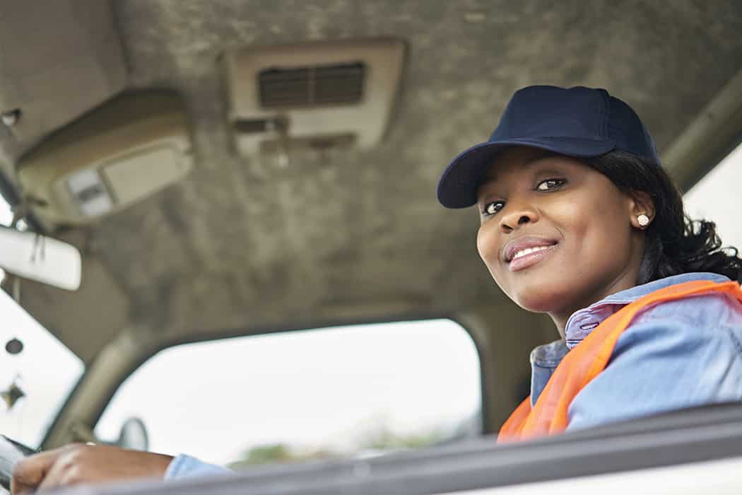Woman working in supply chain indsutry driving truck