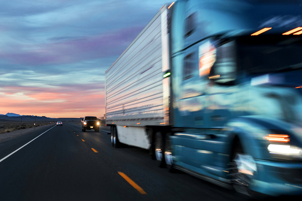 Blurry truck representing spot market freight shipment