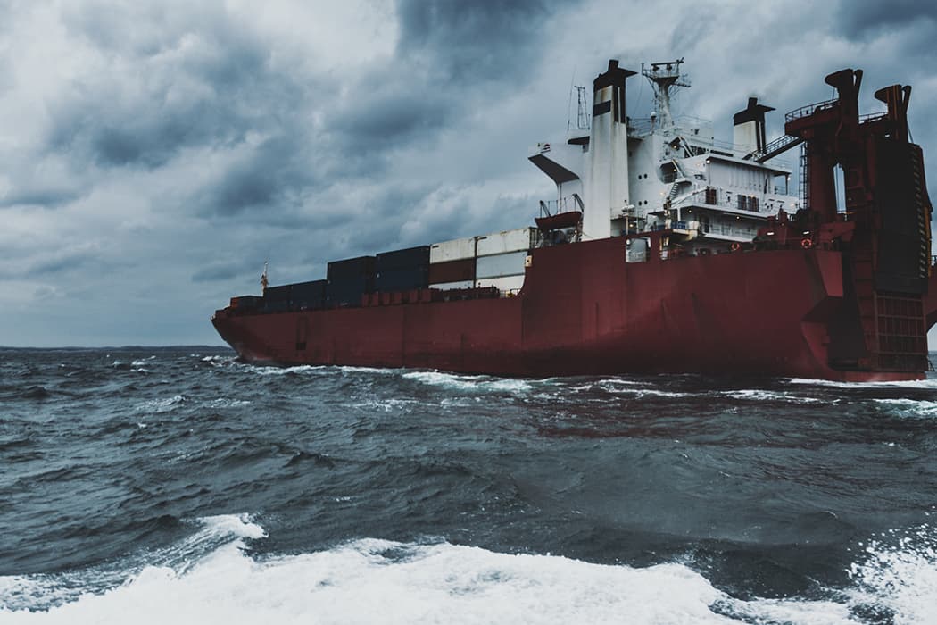 Global ocean shipping boat at sea