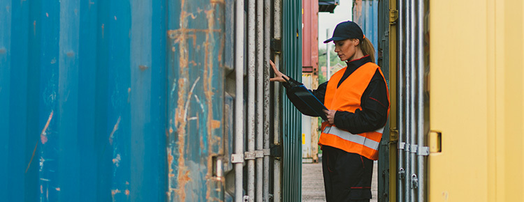 Compliance woman inspecting container 